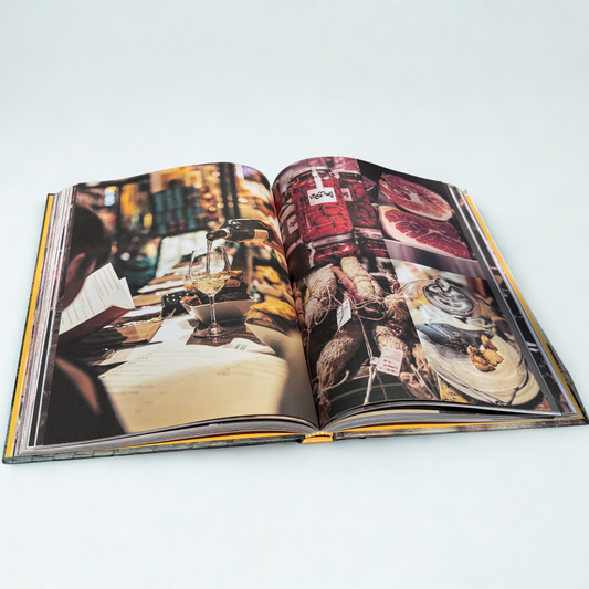 Open book with colorful images on a white background