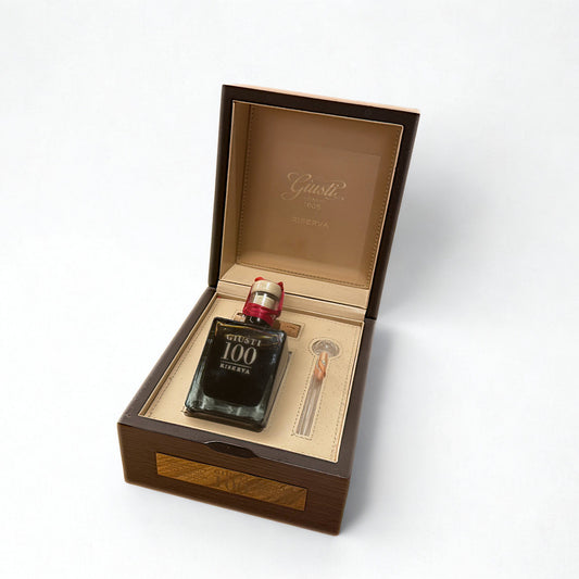 Balsamic bottle with wooden box on a white background