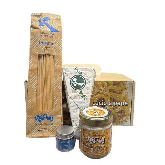 Collection of pasta products including a box, jars, and a bag on a white background