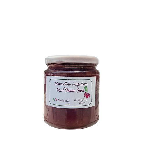 Jar of red onion jam with a label on a white background